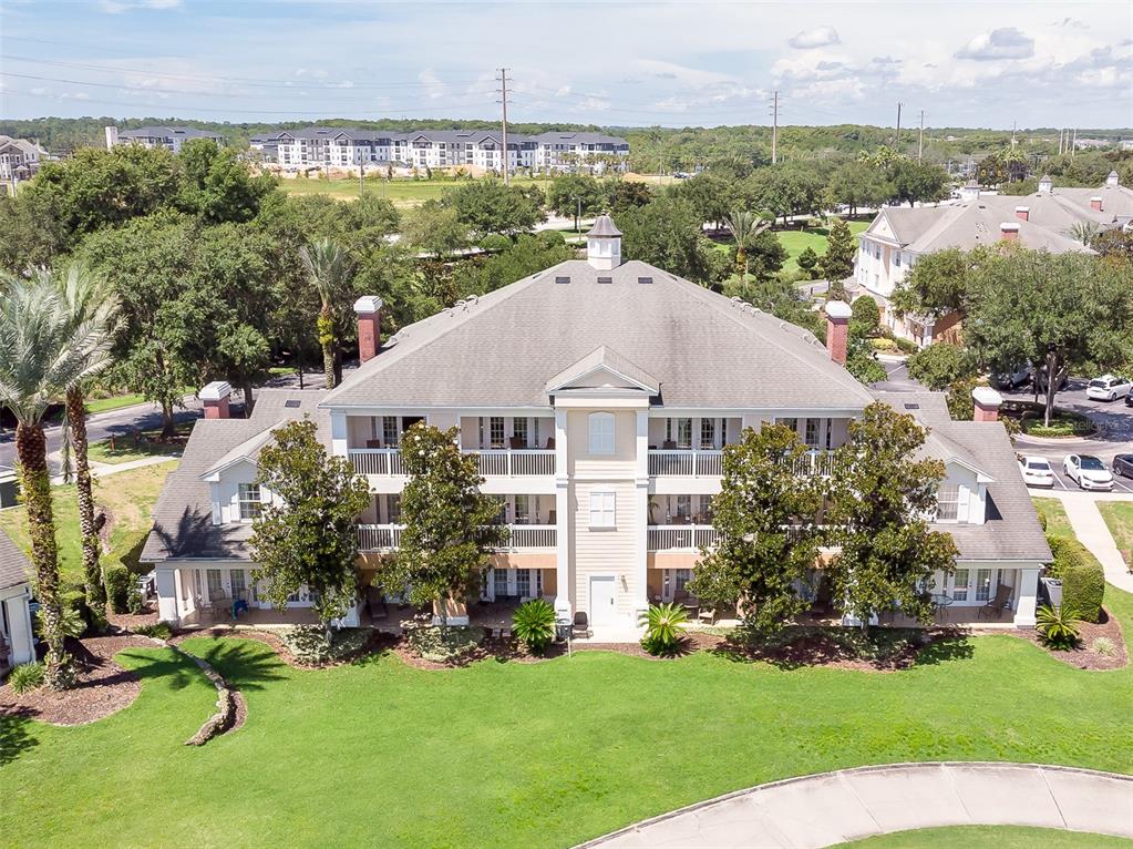 an aerial view of a house with yard swimming pool and outdoor seating