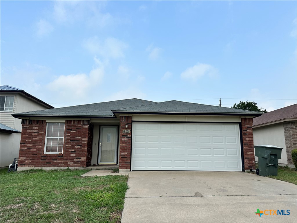 a front view of a house with a garage