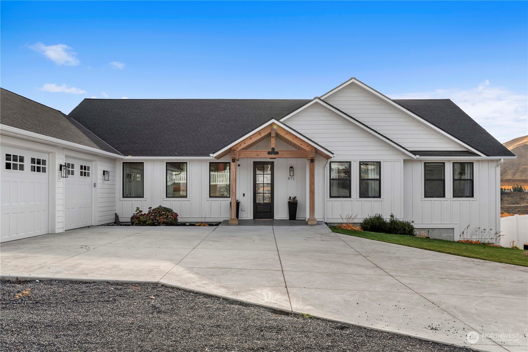 a front view of a house with a garage