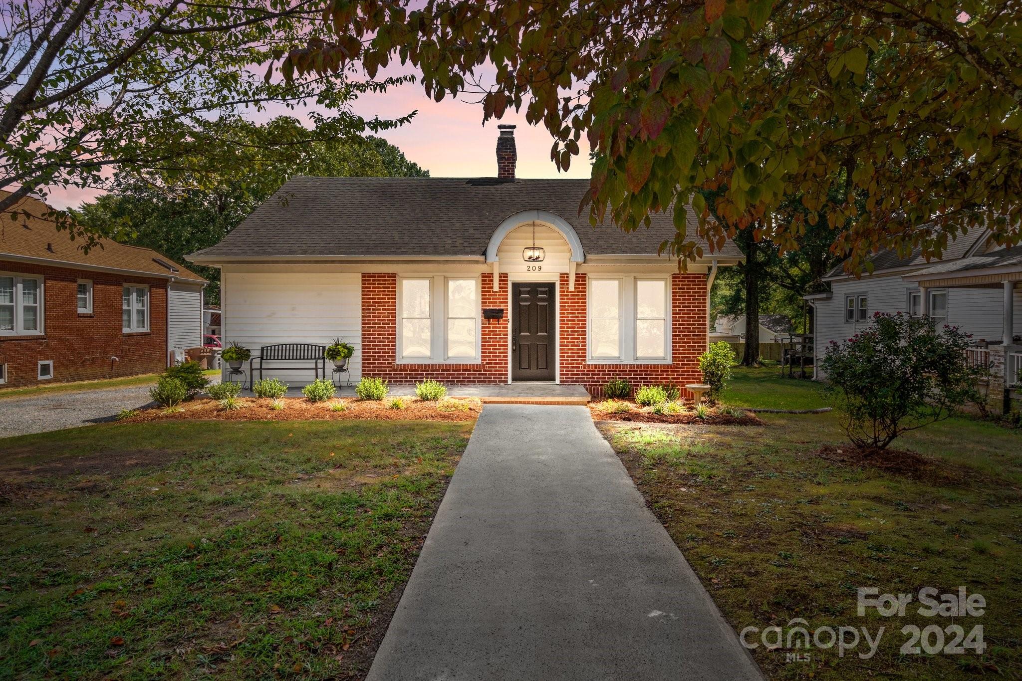 a front view of a house with garden