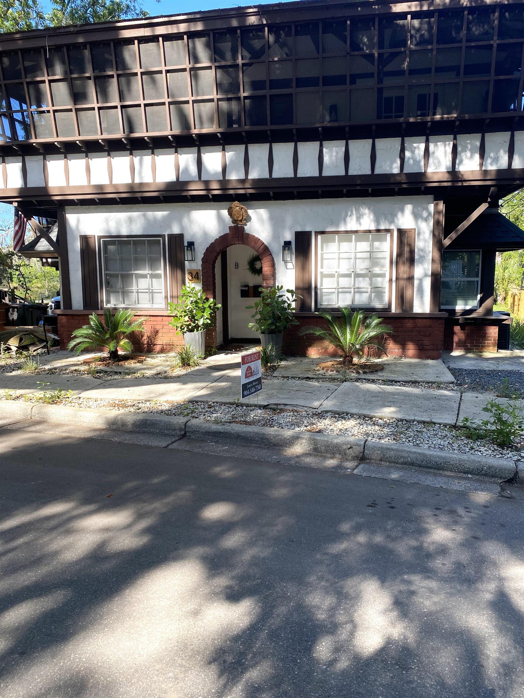 a view of a building with sitting area