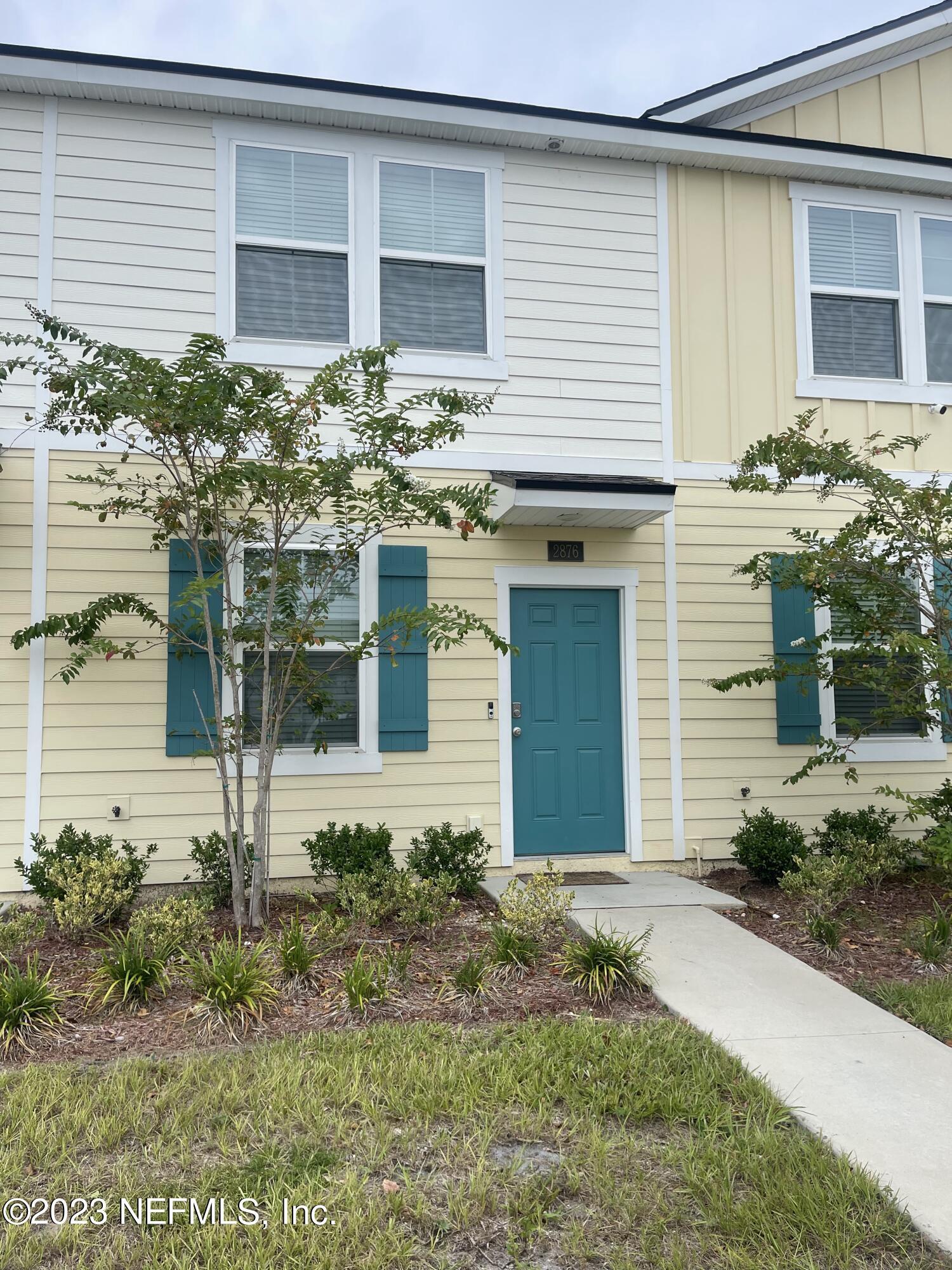 a front view of a house with a yard