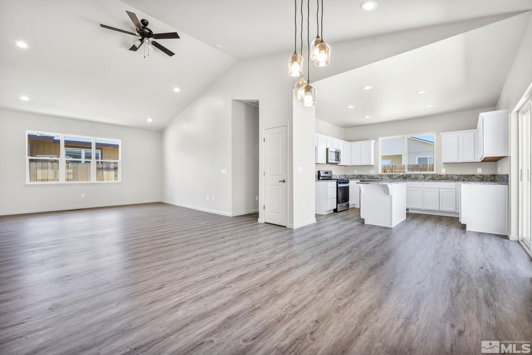 a view of kitchen with wooden floor and window