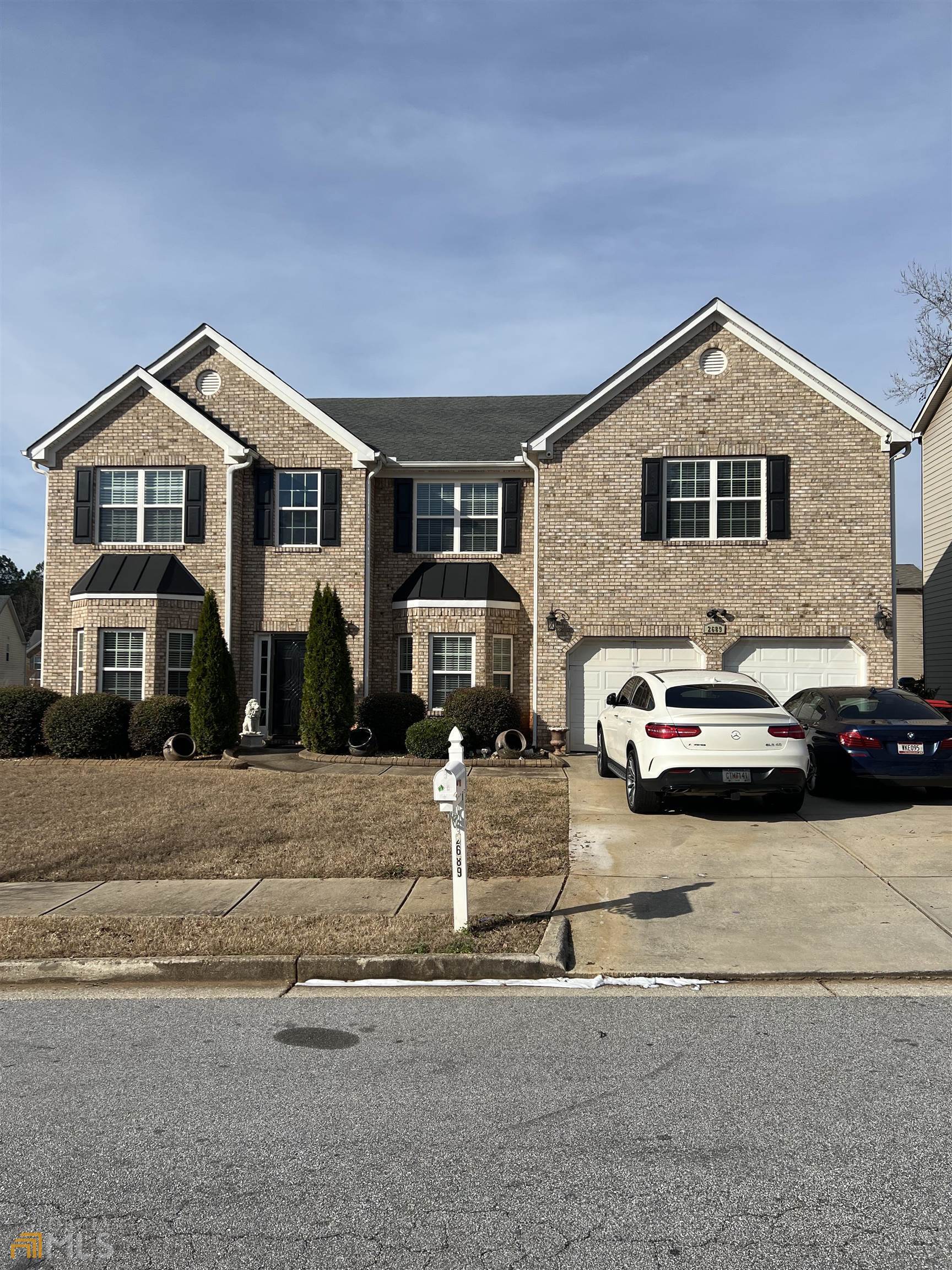 a car parked in front of a house