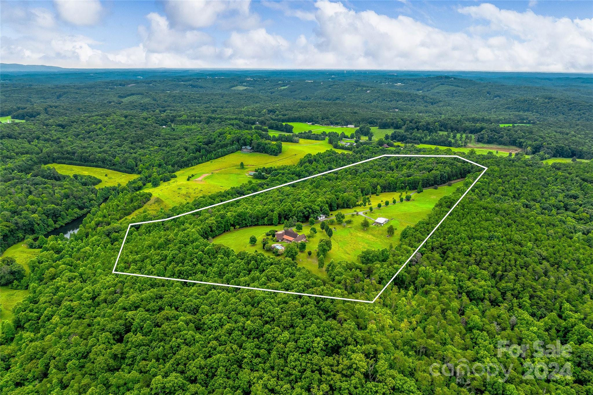 a view of a field with an outdoor space