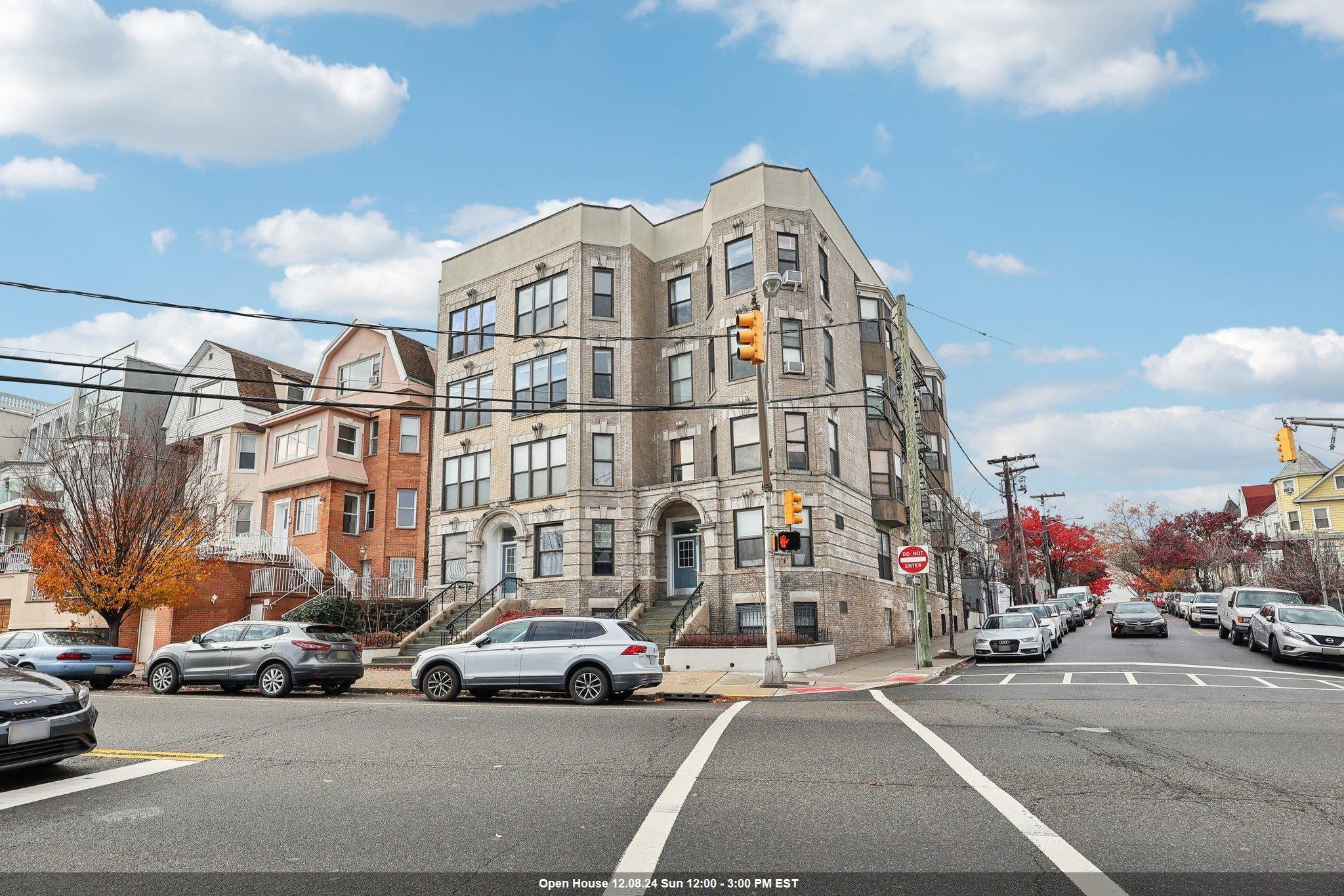 a view of a parked cars in front of a building