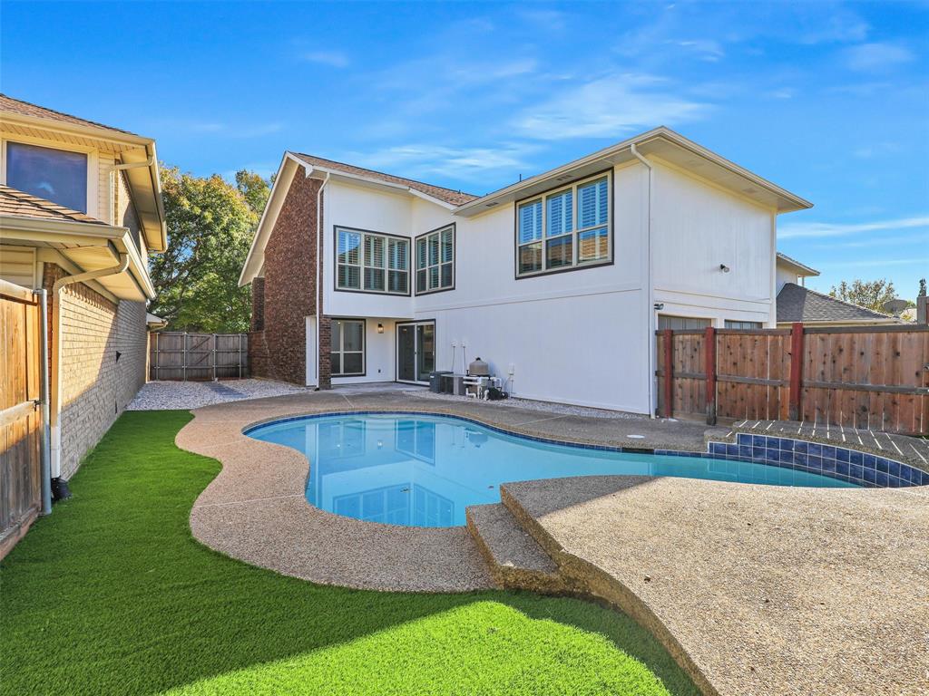 a view of a house with swimming pool and porch