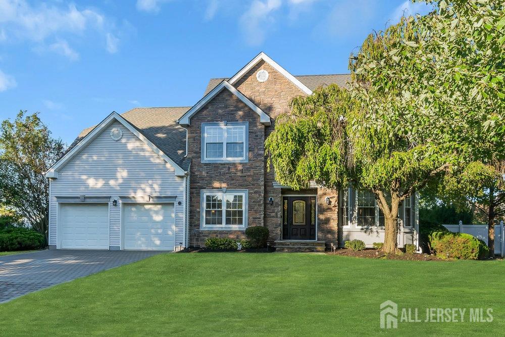 a front view of a house with a garden