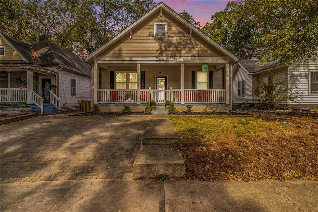 a front view of a house with yard