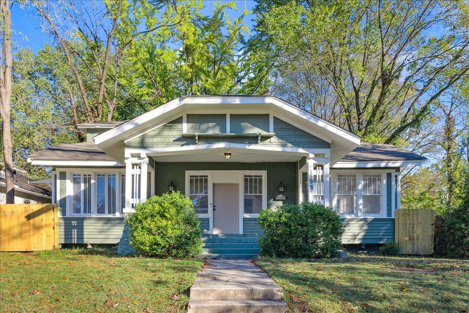 Bungalow-style home with a front yard