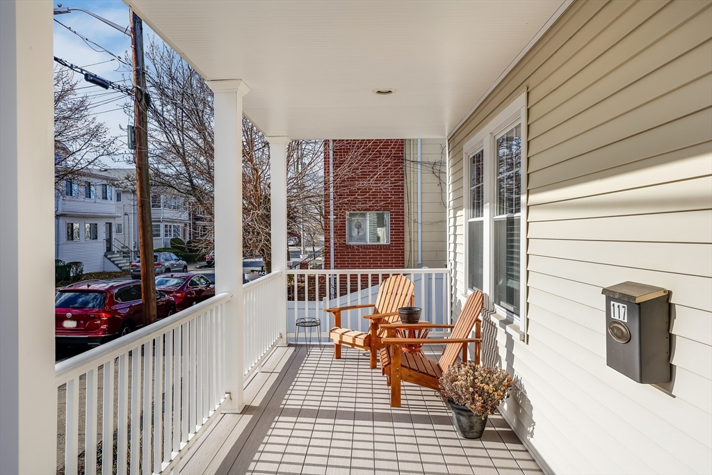 a balcony view with a seating space