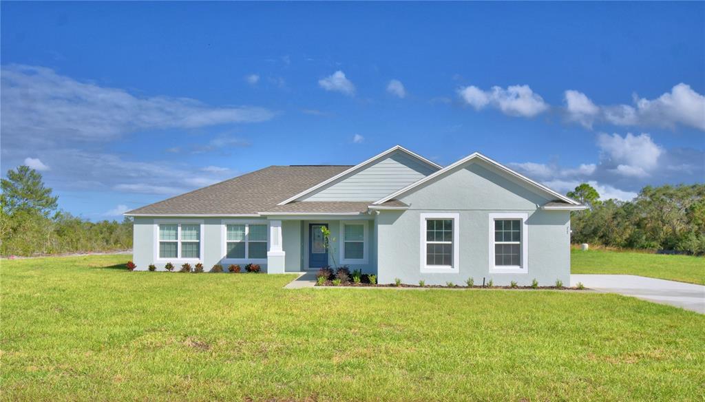 a view of a house with a yard