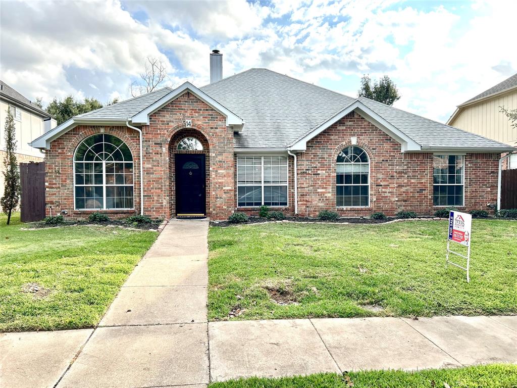 front view of a house with a yard