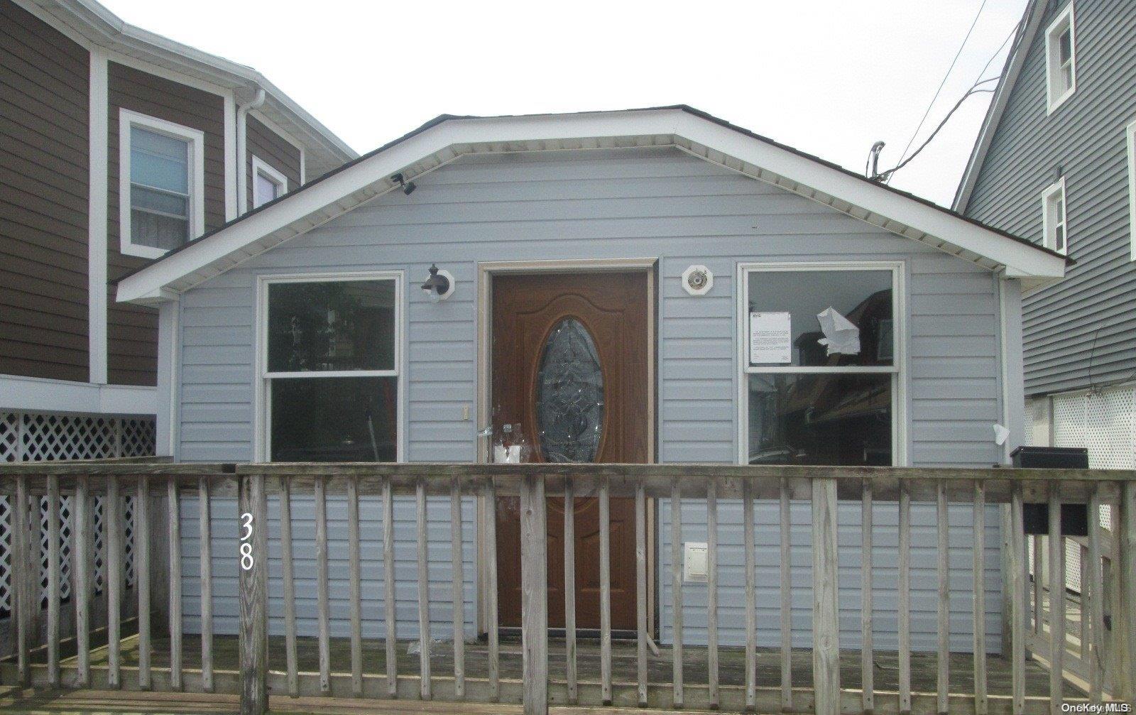 a front view of a house with glass windows