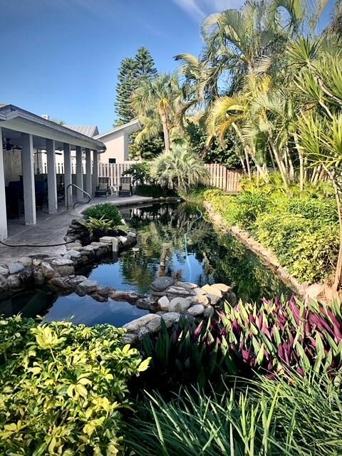 a view of a back yard of the patio of the house