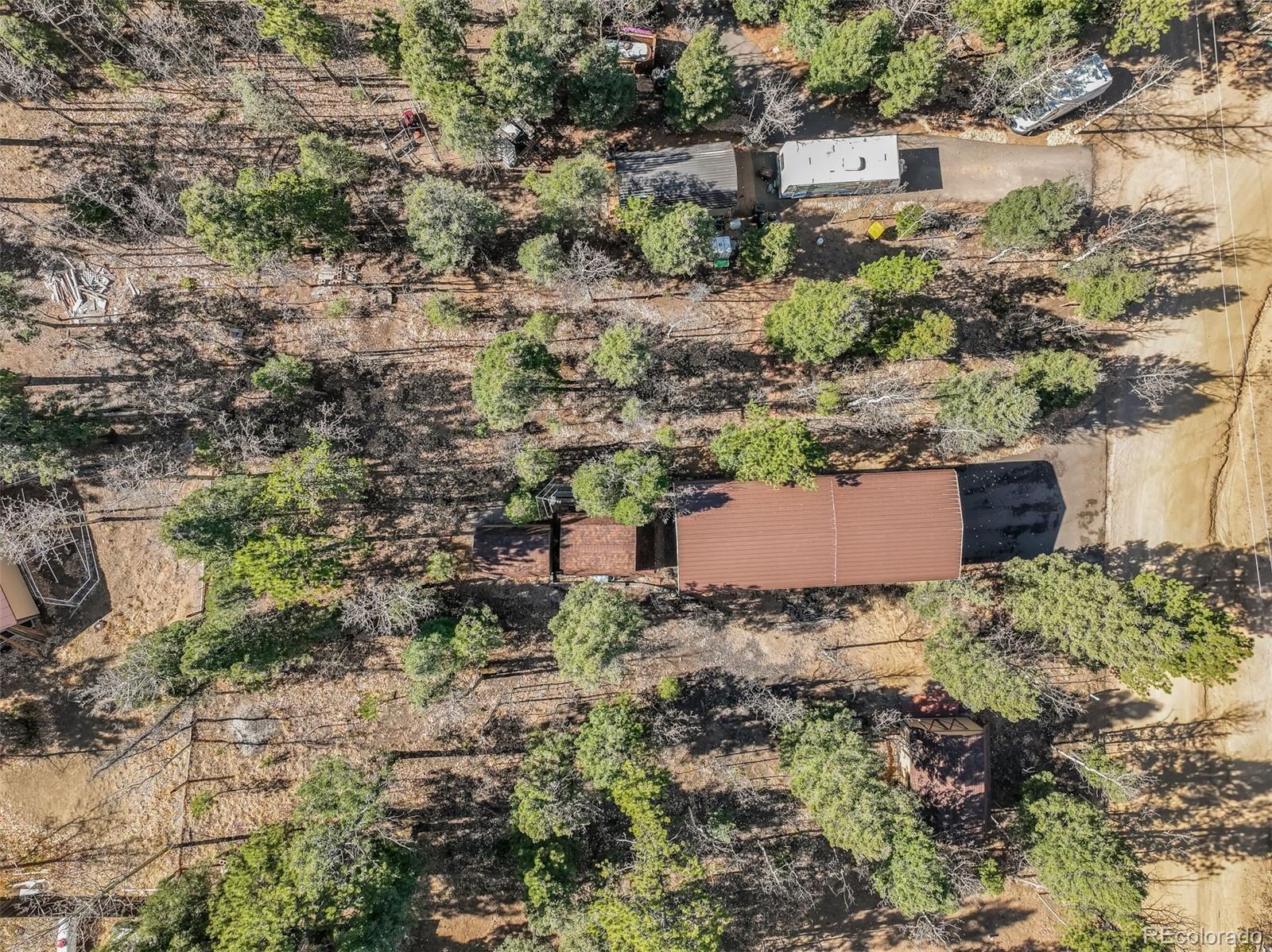 an aerial view of a house with a yard