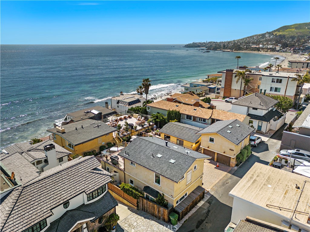 an aerial view of a ocean with city