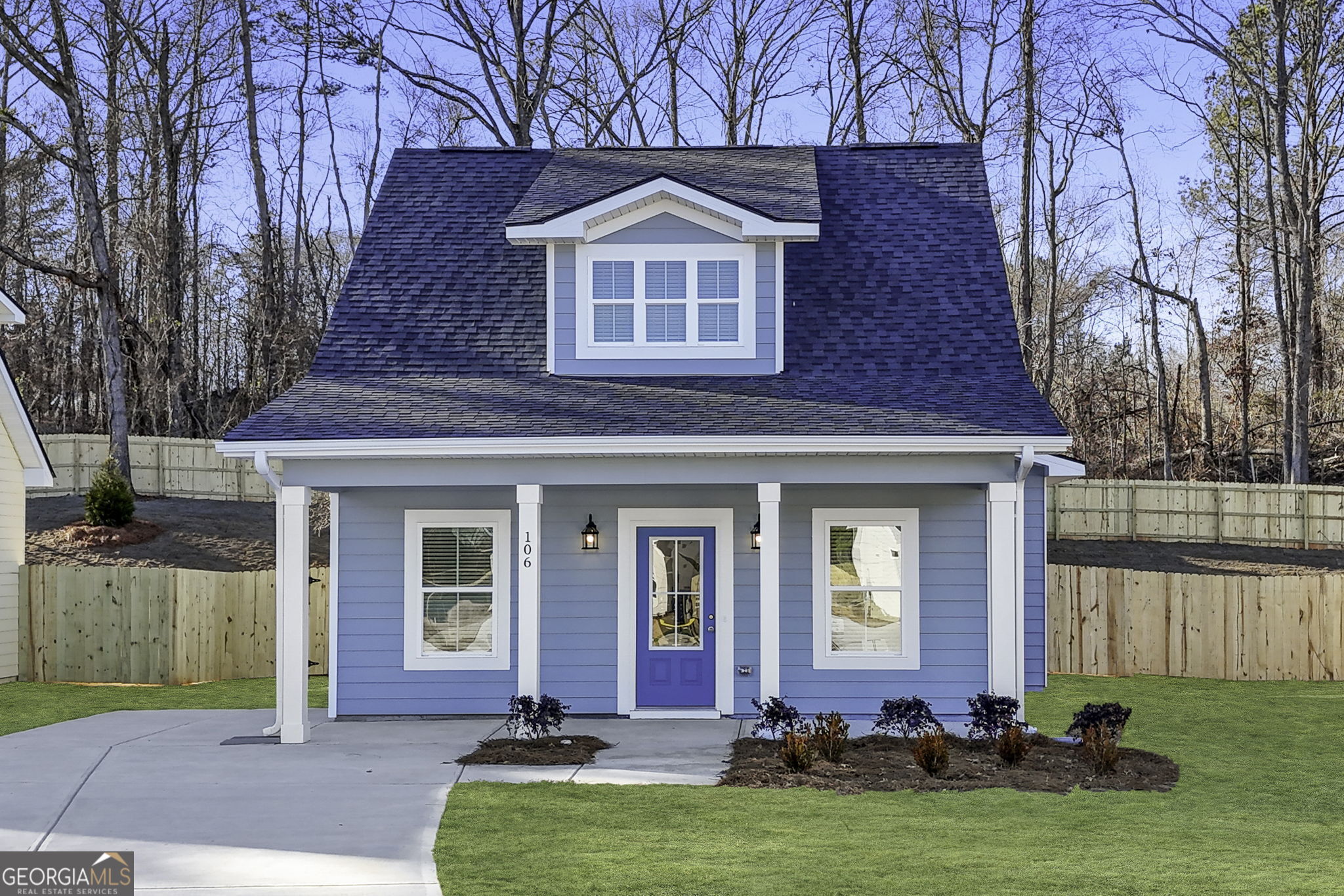 a front view of a house with garden