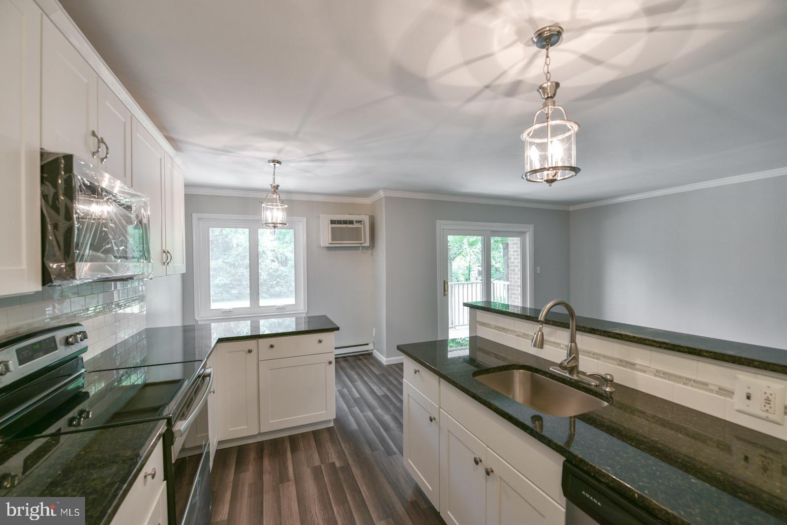 a large kitchen with a large window