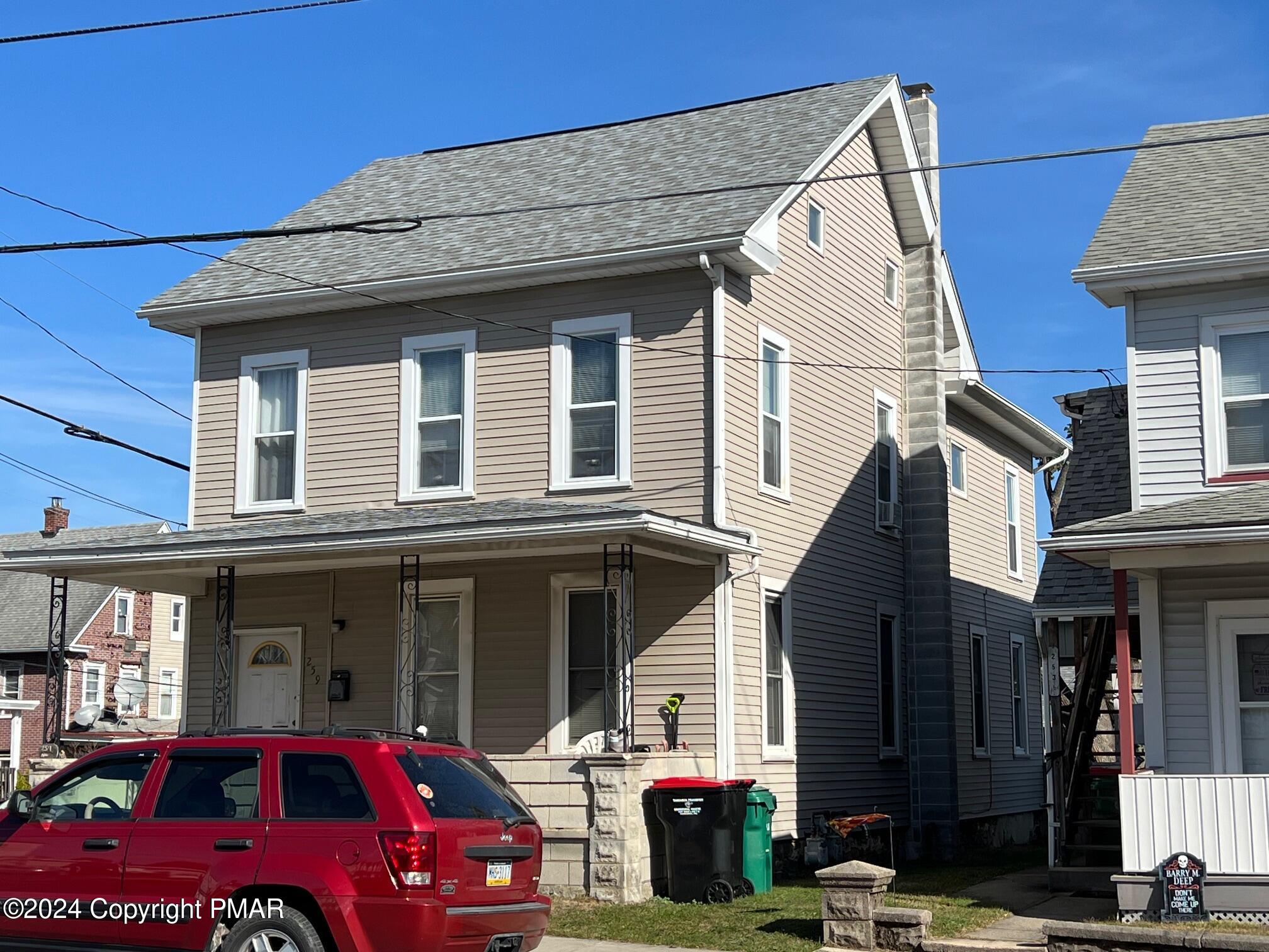 a car parked in front of a house