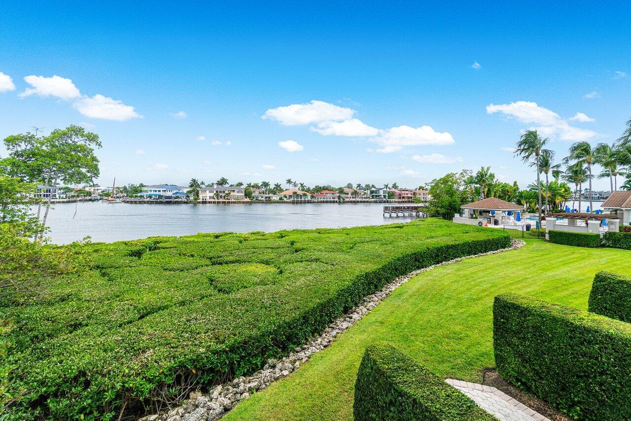 a view of a lake with houses in the back