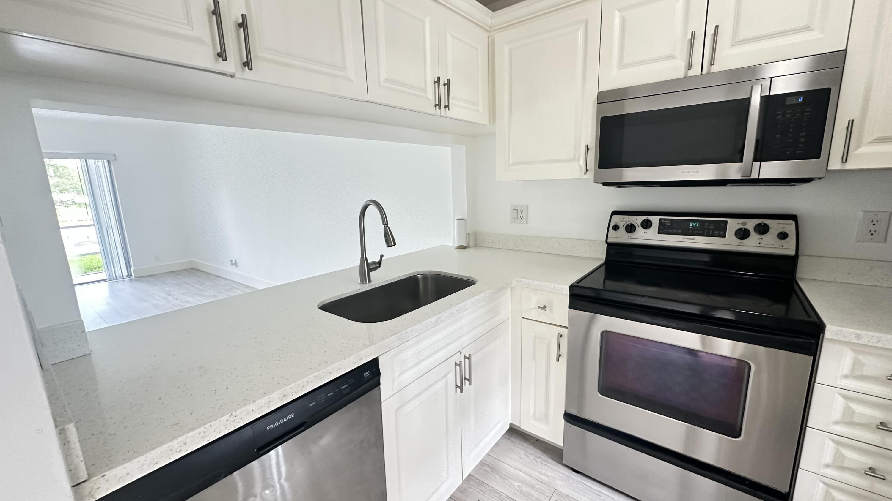 a kitchen with a stove and a microwave