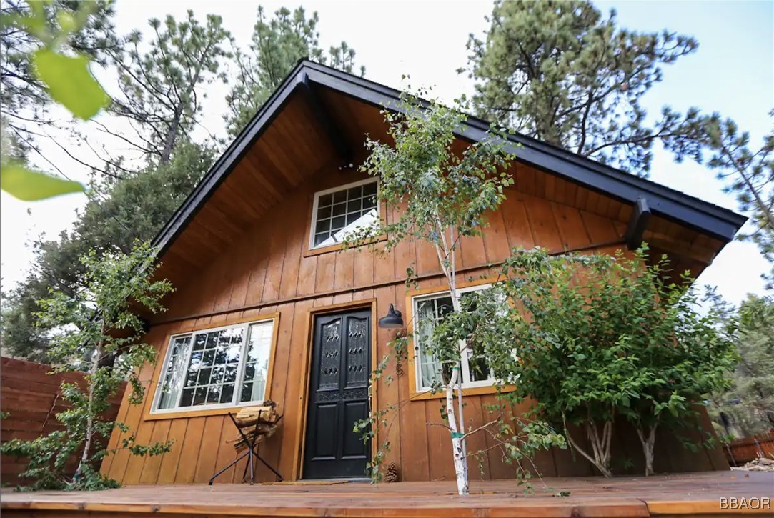 a view of a house with a tree