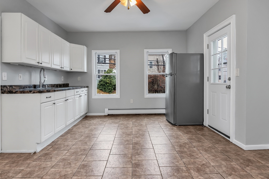 a view of a kitchen with a sink cabinets and a window