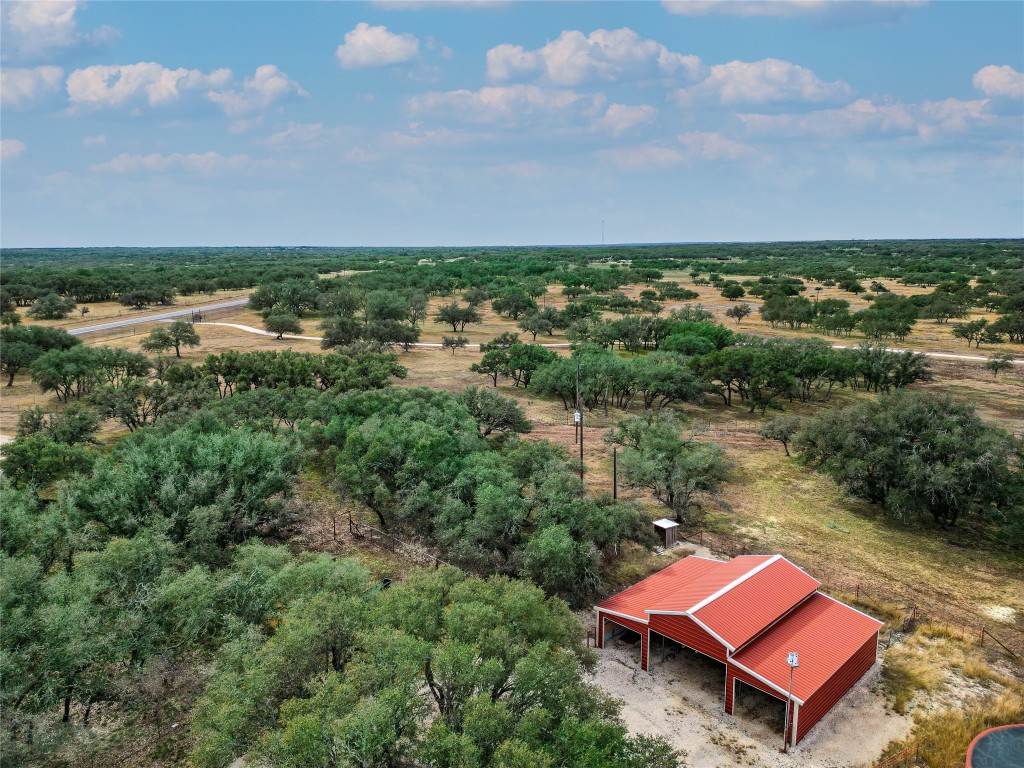 an aerial view of a house with lake view