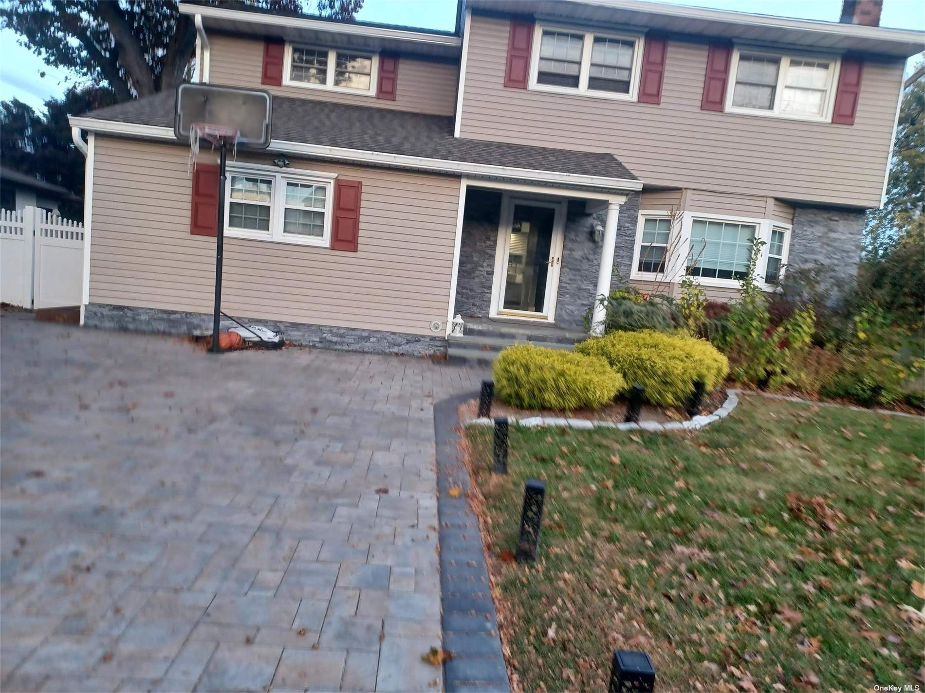 a front view of a house with yard