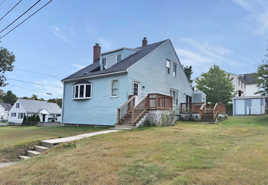 a view of a house with a yard