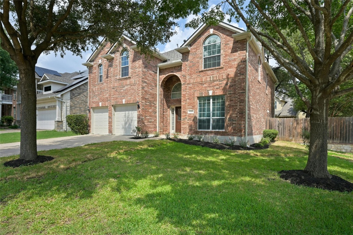 a front view of a house with a yard