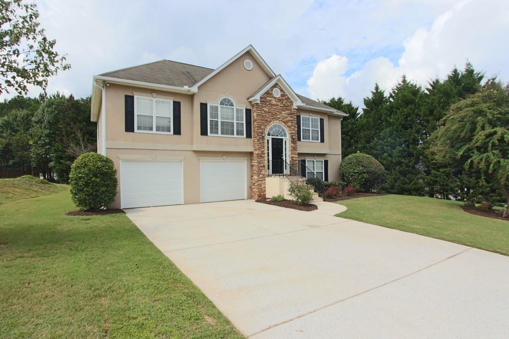 a front view of a house with a yard