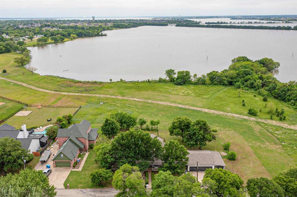 an aerial view of a house with a lake view