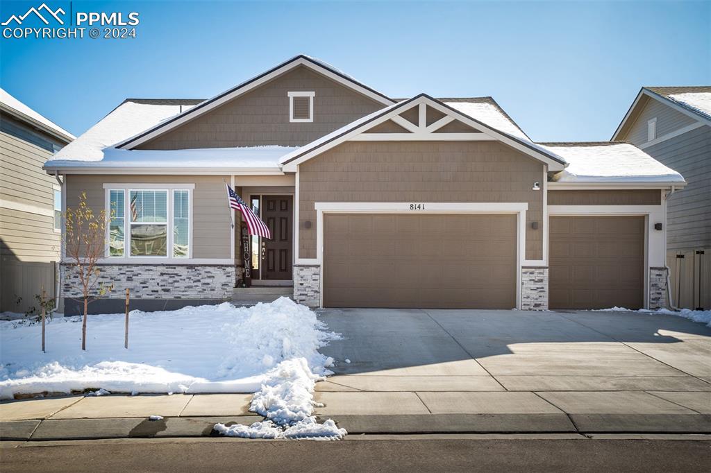 a front view of a house with garage