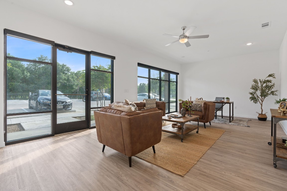 a living room with furniture and a large window