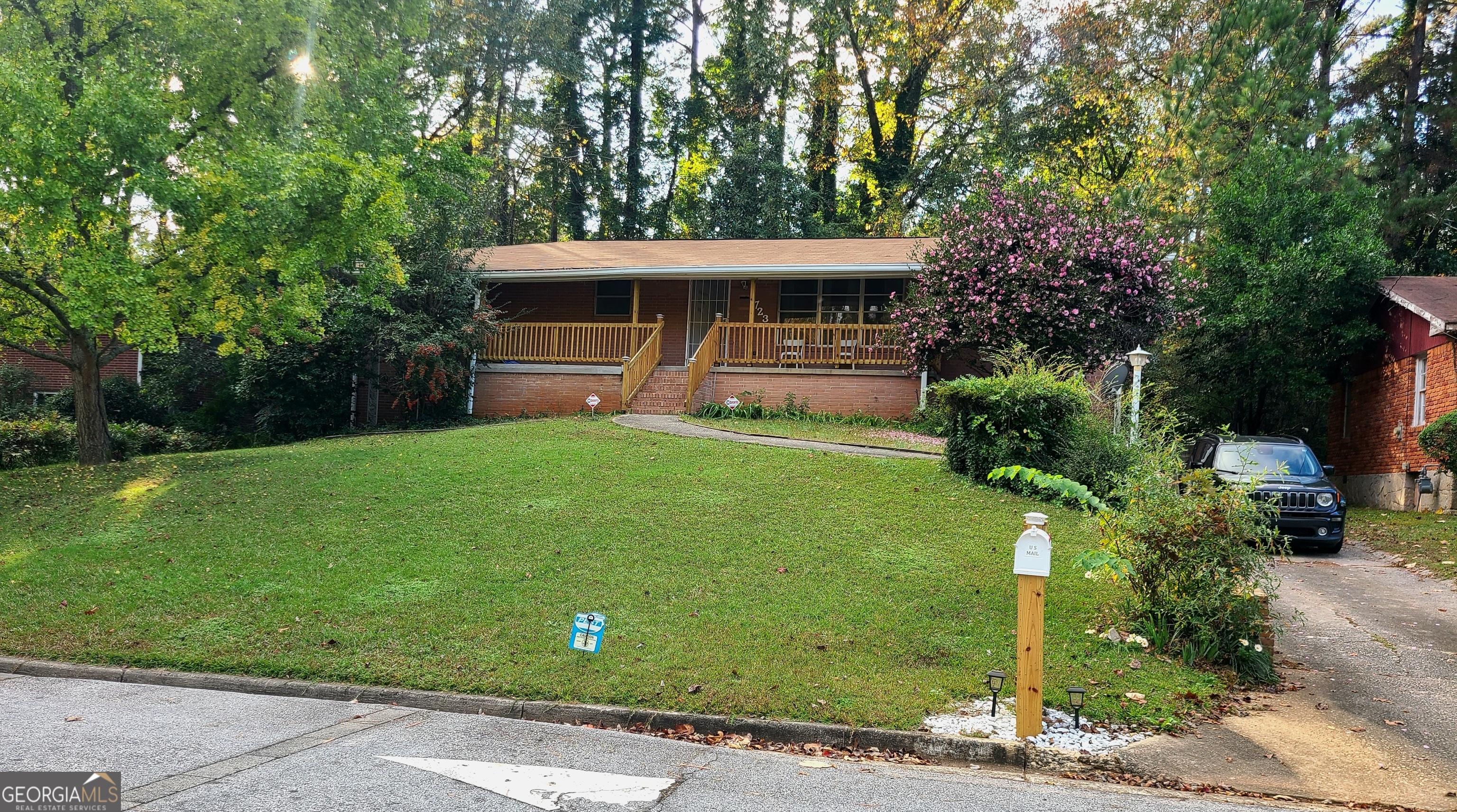 a front view of a house with garden