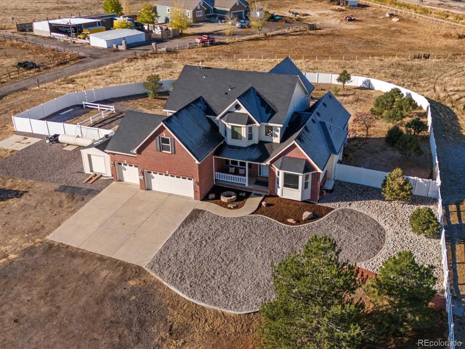 an aerial view of a house with outdoor space