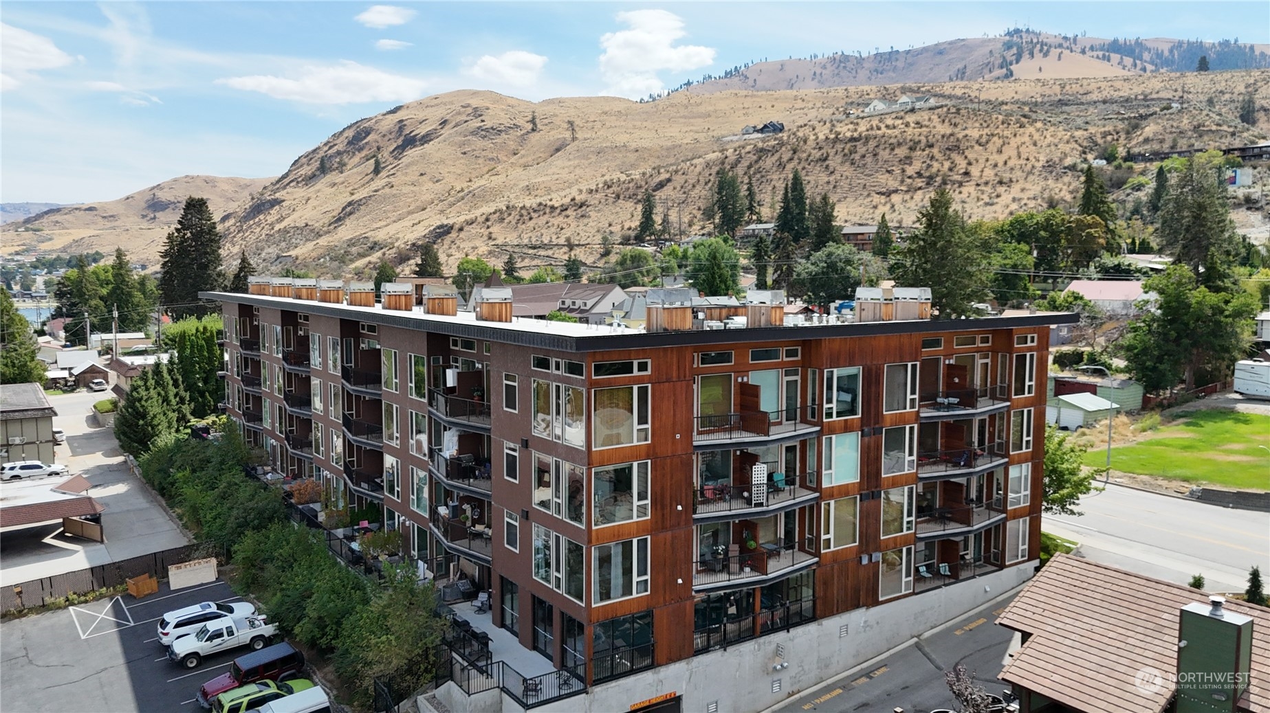 a view of a large building with a mountain