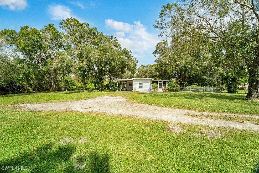 a view of a house with a big yard