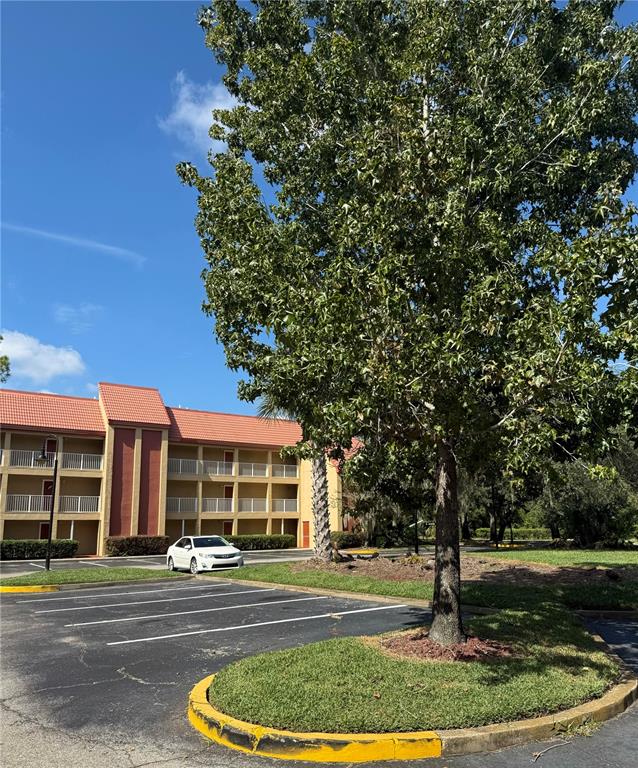 a front view of a building with a garden