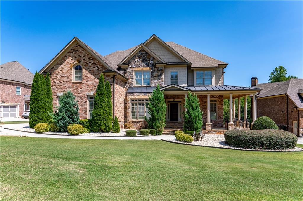 a front view of a house with a yard