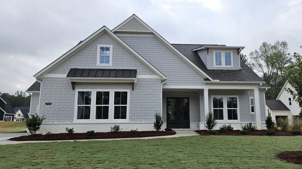 a front view of a house with a yard