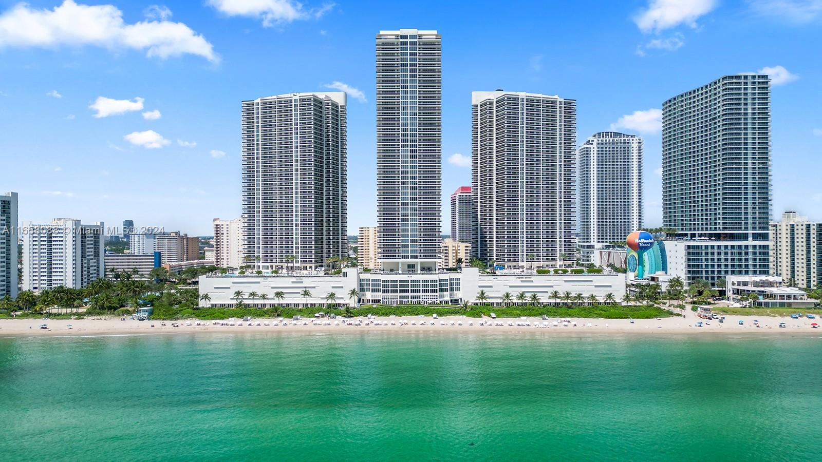 a view of water with tall building and city view