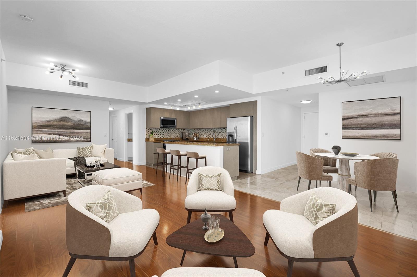 a living room with furniture and a chandelier