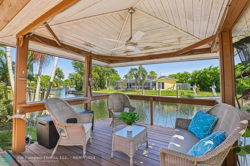 a view of a patio with couches chairs and a table