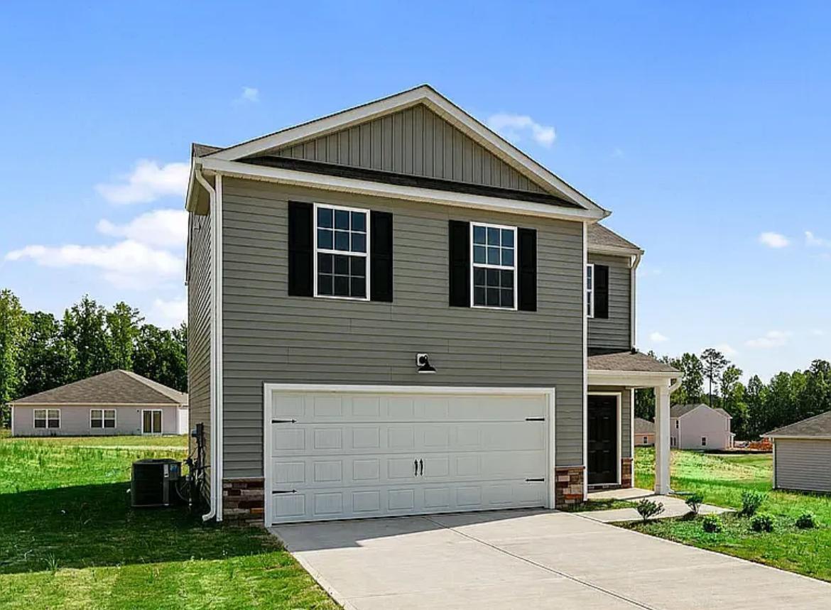 a front view of a house with a yard