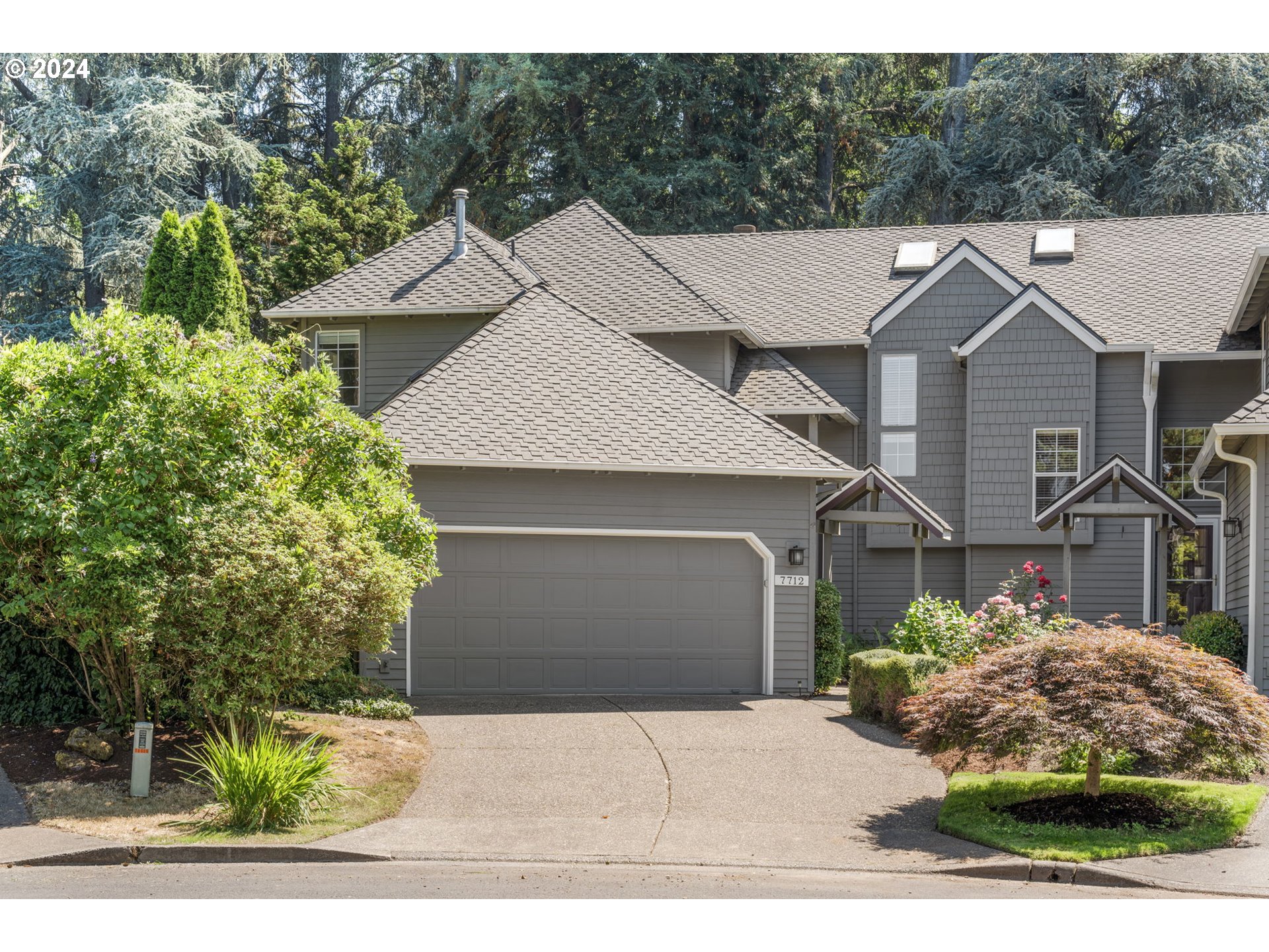 a aerial view of a house with a yard