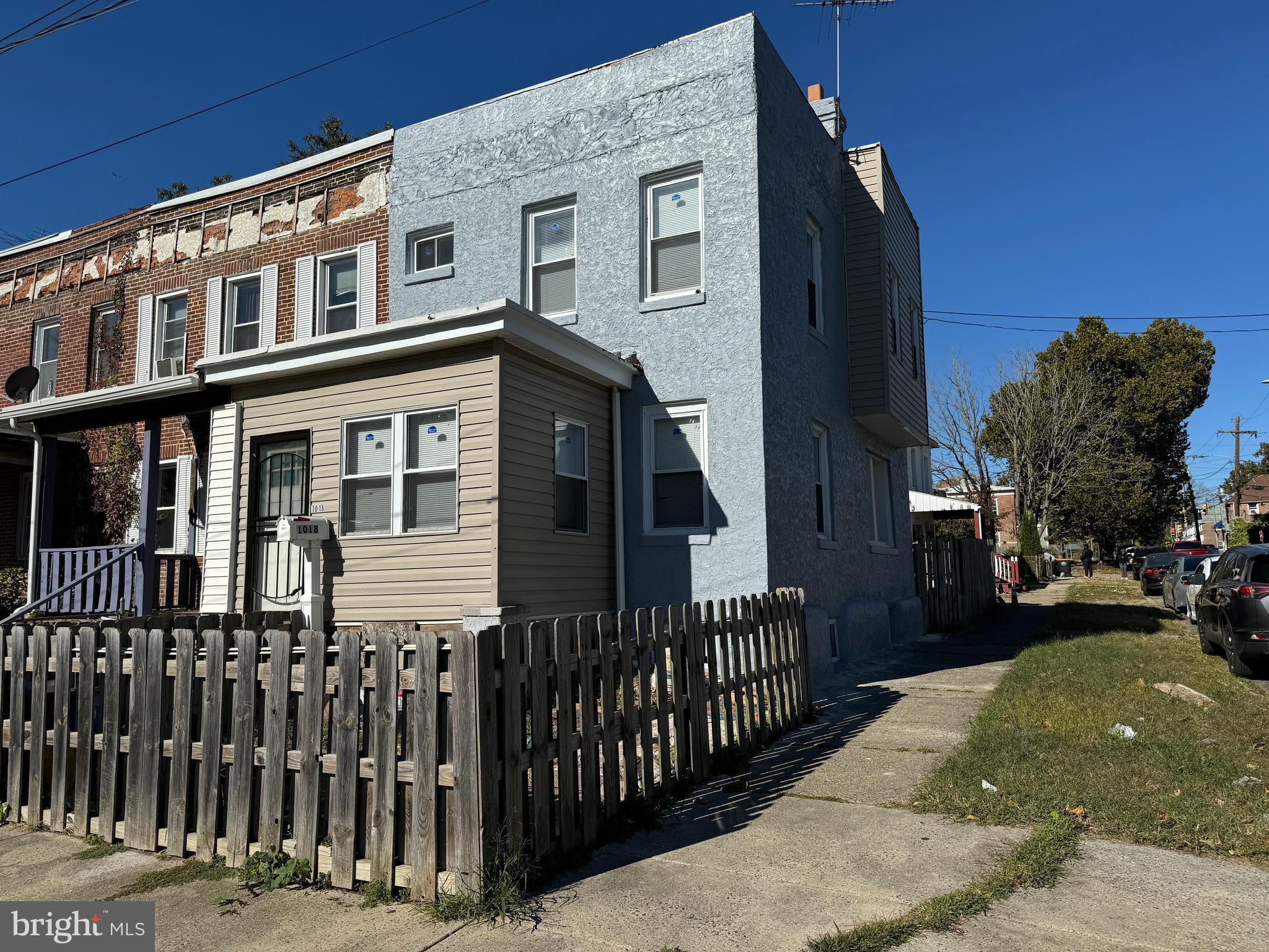 a view of a brick house with many windows