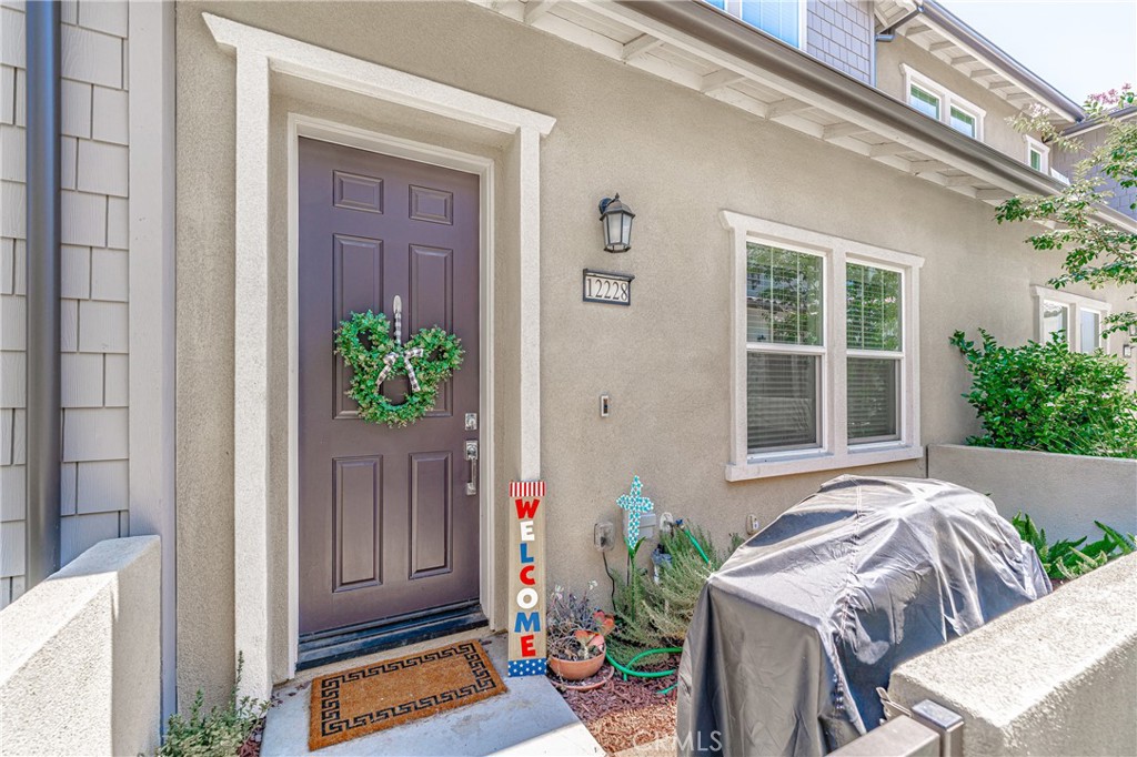 a house with a potted plant in front of it